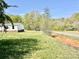 Exterior view of home with green lawn and a street in the distance at 105 Branson Dr, Olin, NC 28660