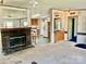 Open living room with fireplace, view of the kitchen, and neutral carpeting at 105 Branson Dr, Olin, NC 28660