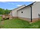 Exterior showcasing the side of the house, with a wooden deck and green lawn at 105 Sterling Ter, Mooresville, NC 28115