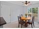 Cozy breakfast nook featuring a wooden table with four chairs and sliding glass doors to the backyard at 105 Sterling Ter, Mooresville, NC 28115