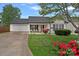 Charming single Gathering home featuring a lush front yard, fresh landscape and an attached two car garage at 105 Sterling Ter, Mooresville, NC 28115