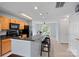 Bright kitchen featuring a breakfast bar with black countertops and chairs plus sleek, black appliances at 105 Sterling Ter, Mooresville, NC 28115