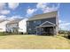 Spacious backyard featuring a screened-in porch and patio, ideal for outdoor gatherings and relaxation at 1077 Hearth Sw Ln, Concord, NC 28025