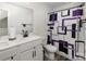 Bathroom featuring double sinks and a tub/shower combo with a modern shower curtain at 1077 Hearth Sw Ln, Concord, NC 28025
