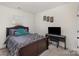 Cozy bedroom with a dark wood bed frame and musical keyboard, creating a relaxing atmosphere at 1077 Hearth Sw Ln, Concord, NC 28025