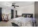 Bedroom features a workstation, black accents, carpet flooring, and natural light at 1077 Hearth Sw Ln, Concord, NC 28025