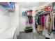 Spacious walk-in closet with shelving, clothing racks, and carpet flooring providing ample storage at 1077 Hearth Sw Ln, Concord, NC 28025