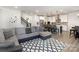 Open-concept living area with stylish furnishings and modern kitchen island at 1077 Hearth Sw Ln, Concord, NC 28025
