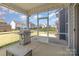 View of stainless steel grill in screened-in porch area, perfect for outdoor cooking and entertaining at 1077 Hearth Sw Ln, Concord, NC 28025