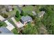 Aerial view of a brick home featuring a deck, well-manicured lawn, and a spacious driveway at 1158 Waterford Dr, Hickory, NC 28602