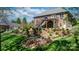 Stone fire pit with seating, surrounded by a beautifully landscaped backyard at 1158 Waterford Dr, Hickory, NC 28602