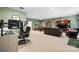 Spacious basement features a home office, entertainment area, and fitness equipment at 1158 Waterford Dr, Hickory, NC 28602