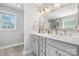 Bright bathroom featuring double sinks, quartz countertops, and modern fixtures at 1158 Waterford Dr, Hickory, NC 28602