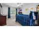 Cozy bedroom with plush carpet, dark wood furniture, and a bright window at 1158 Waterford Dr, Hickory, NC 28602