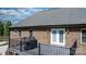 The covered back deck features a grill and outdoor seating area at 1158 Waterford Dr, Hickory, NC 28602