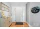 Inviting foyer with hardwood floors, decorative door sidelights, and a 'Welcome' sign at 1158 Waterford Dr, Hickory, NC 28602