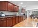 Well-equipped kitchen with stainless steel appliances, wooden cabinetry, and hardwood floors at 1158 Waterford Dr, Hickory, NC 28602