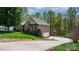 Brick house featuring a driveway, a garage and beautiful landscaping at 1158 Waterford Dr, Hickory, NC 28602