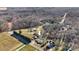 Aerial view of the property showcasing the home, outbuildings, and surrounding landscape at 119 Loray Ln, Statesville, NC 28625
