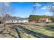 Spacious backyard of the house with covered porches and an outbuilding at 119 Loray Ln, Statesville, NC 28625