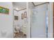 Clean bathroom with shower, toilet, vanity, and storage cabinet offering essential amenities at 119 Loray Ln, Statesville, NC 28625