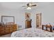 Bedroom with wooden dressers and a view into the bathroom, offering practical storage solutions at 119 Loray Ln, Statesville, NC 28625