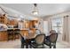 Open dining room featuring a classic table set and a seamless flow to the kitchen at 119 Loray Ln, Statesville, NC 28625