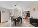 Bright dining area featuring classic furnishings and seamless connection to the living room at 119 Loray Ln, Statesville, NC 28625