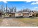 Charming single-story home with red shutters, a covered front porch, and a spacious yard at 119 Loray Ln, Statesville, NC 28625