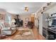 Inviting living room with hardwood floors, cozy seating, and a wood-burning stove at 119 Loray Ln, Statesville, NC 28625
