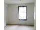 This bedroom features a window with sheer curtains and neutral carpet at 1230 Roberts St, China Grove, NC 28023
