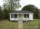 Charming one-story home featuring a well-maintained front yard and classic architectural details at 1230 Roberts St, China Grove, NC 28023
