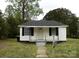 Charming single-story home with a welcoming front yard and black shutters at 1230 Roberts St, China Grove, NC 28023