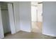 A hallway with beige carpet leads to other rooms of the home at 1230 Roberts St, China Grove, NC 28023