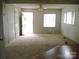 Inviting living room featuring carpet and transition flooring to an adjacent space at 1230 Roberts St, China Grove, NC 28023
