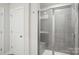 Modern bathroom featuring tiled shower with a glass door and a built-in bench at 1240 Morehead Dr, Salisbury, NC 28144