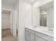 Well-lit bathroom featuring dual vanity sinks and a framed mirror at 1240 Morehead Dr, Salisbury, NC 28144