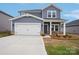Charming two-story home featuring a two-car garage and inviting front porch at 1240 Morehead Dr, Salisbury, NC 28144