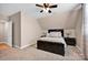 Neutral bedroom featuring dark furniture, a ceiling fan and bedside lamps at 126 Top Flite Dr, Statesville, NC 28677