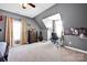 This bedroom includes carpet, curtains, a ceiling fan, and a wooden dresser at 126 Top Flite Dr, Statesville, NC 28677