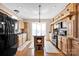 Spacious kitchen features updated appliances, wood cabinetry and a central island, ideal for culinary enthusiasts at 126 Top Flite Dr, Statesville, NC 28677