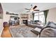 Cozy living room featuring a stone fireplace, hardwood floors, and comfortable seating at 126 Top Flite Dr, Statesville, NC 28677