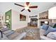 Inviting living room with a stone fireplace, hardwood floors, and comfortable seating arrangement at 126 Top Flite Dr, Statesville, NC 28677
