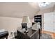 This office features a dark wooden desk, black rolling chair and functional lighting at 126 Top Flite Dr, Statesville, NC 28677