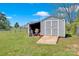Backyard shed with a ramp for easy access to store lawn care equipment at 126 Top Flite Dr, Statesville, NC 28677