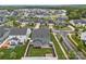 An aerial view of a home with a well-manicured lawn, an outdoor hot tub, and a fenced backyard at 12710 Es Draper Dr, Huntersville, NC 28078