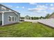A spacious, green backyard with a newly installed hot tub and a fenced perimeter for privacy at 12710 Es Draper Dr, Huntersville, NC 28078