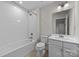 Cozy bathroom with shower-tub combo and white vanity with sink at 12710 Es Draper Dr, Huntersville, NC 28078