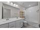 Bathroom features a double vanity, bath tub, and white tiled walls at 12710 Es Draper Dr, Huntersville, NC 28078