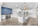 Spacious kitchen with a large island, stainless appliances, and a built-in wine fridge at 12710 Es Draper Dr, Huntersville, NC 28078
